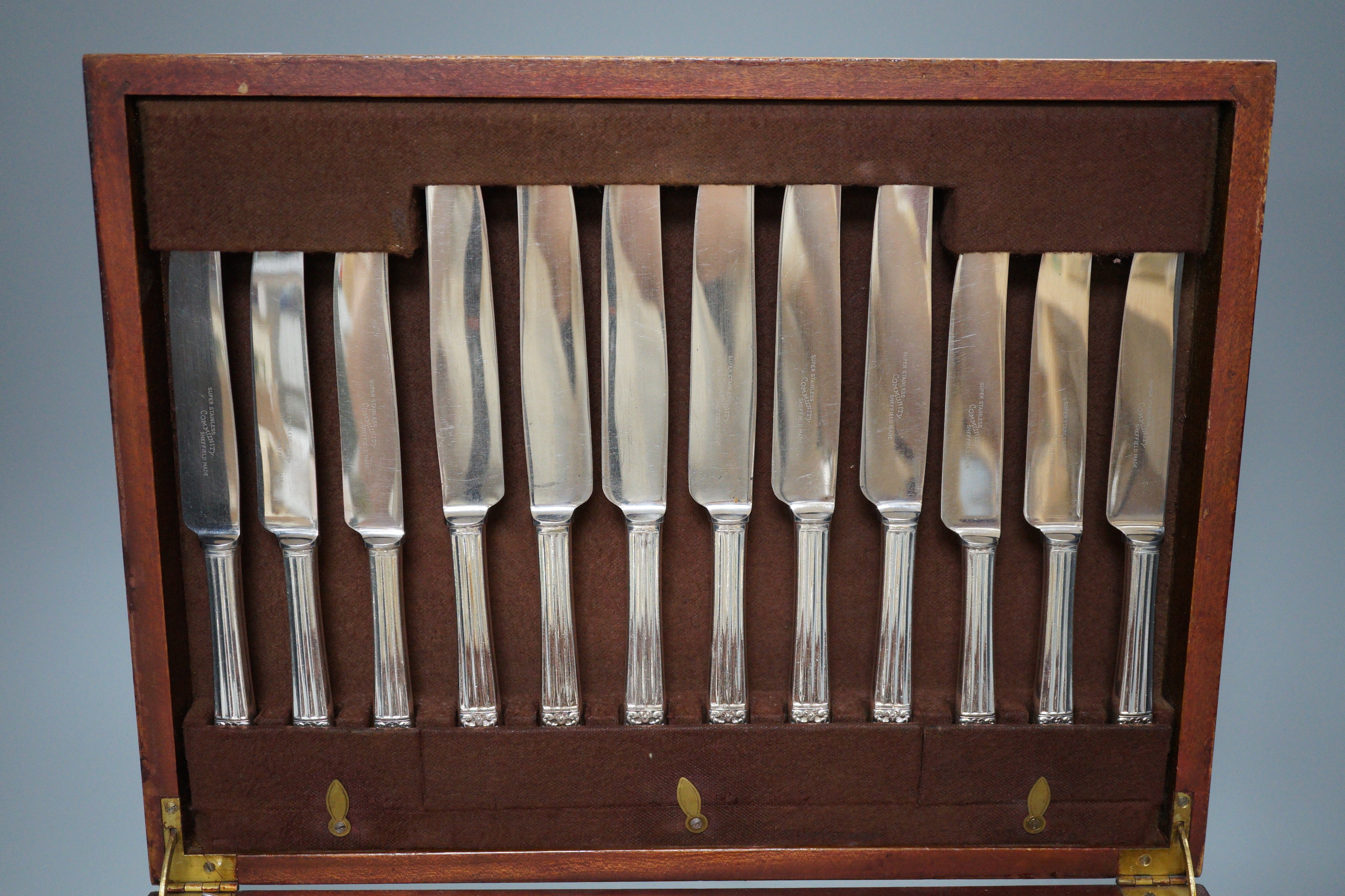 A canteen of silver plated cutlery, a four piece plated tea set and a plated egg coddler.